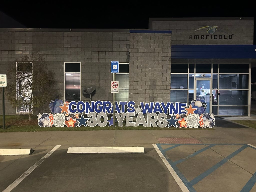 Work anniversary yard sign outside a local business